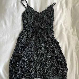 Short black dress with white polka dots